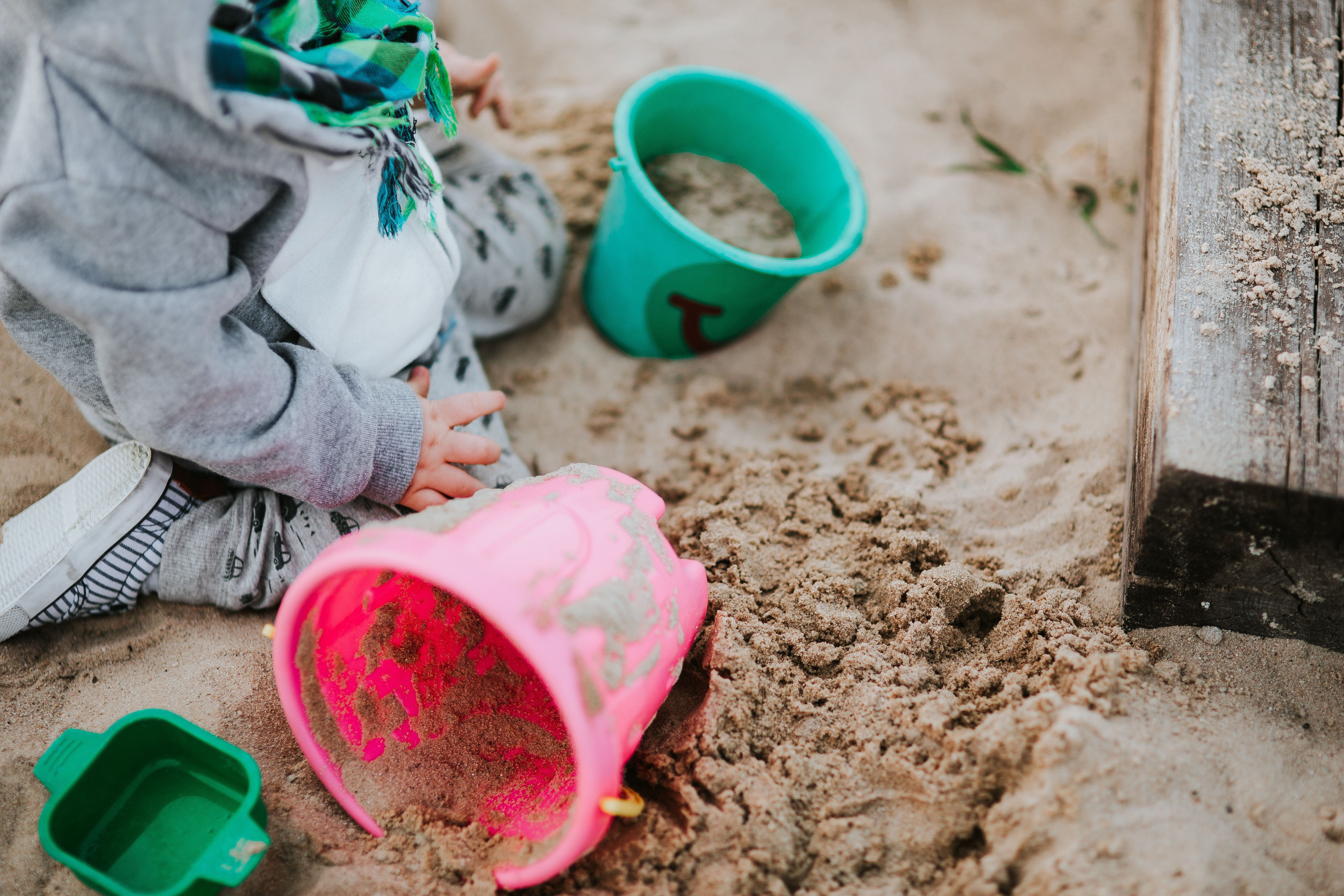 kaboompics_Toddler playing in the sand